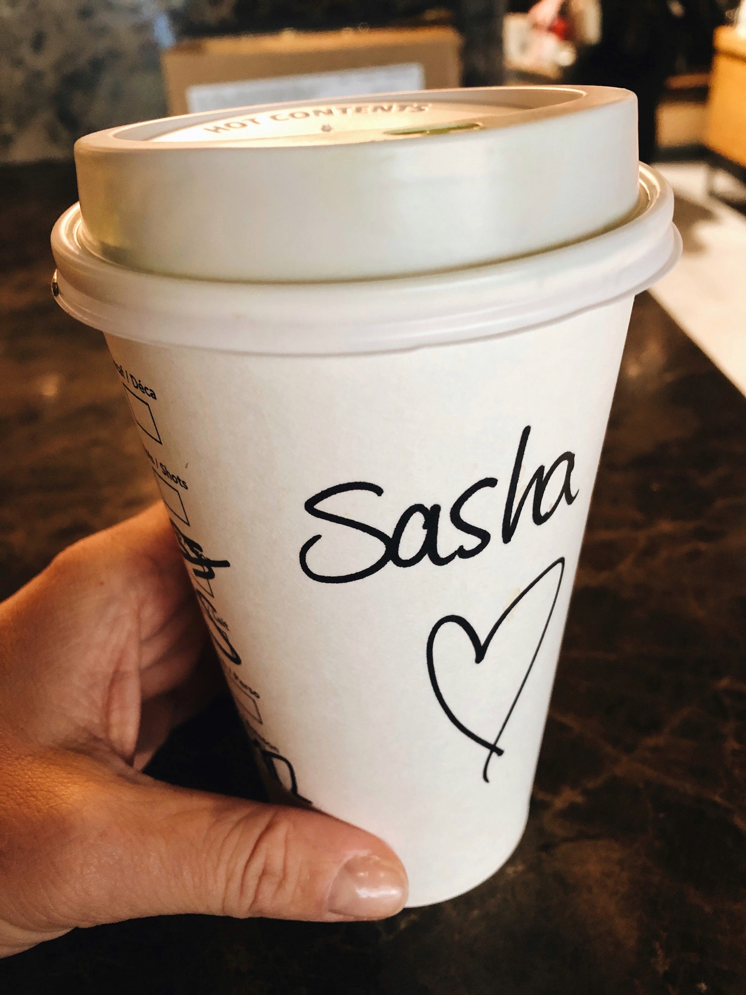 Starbucks coffee cup with Sasha name on it